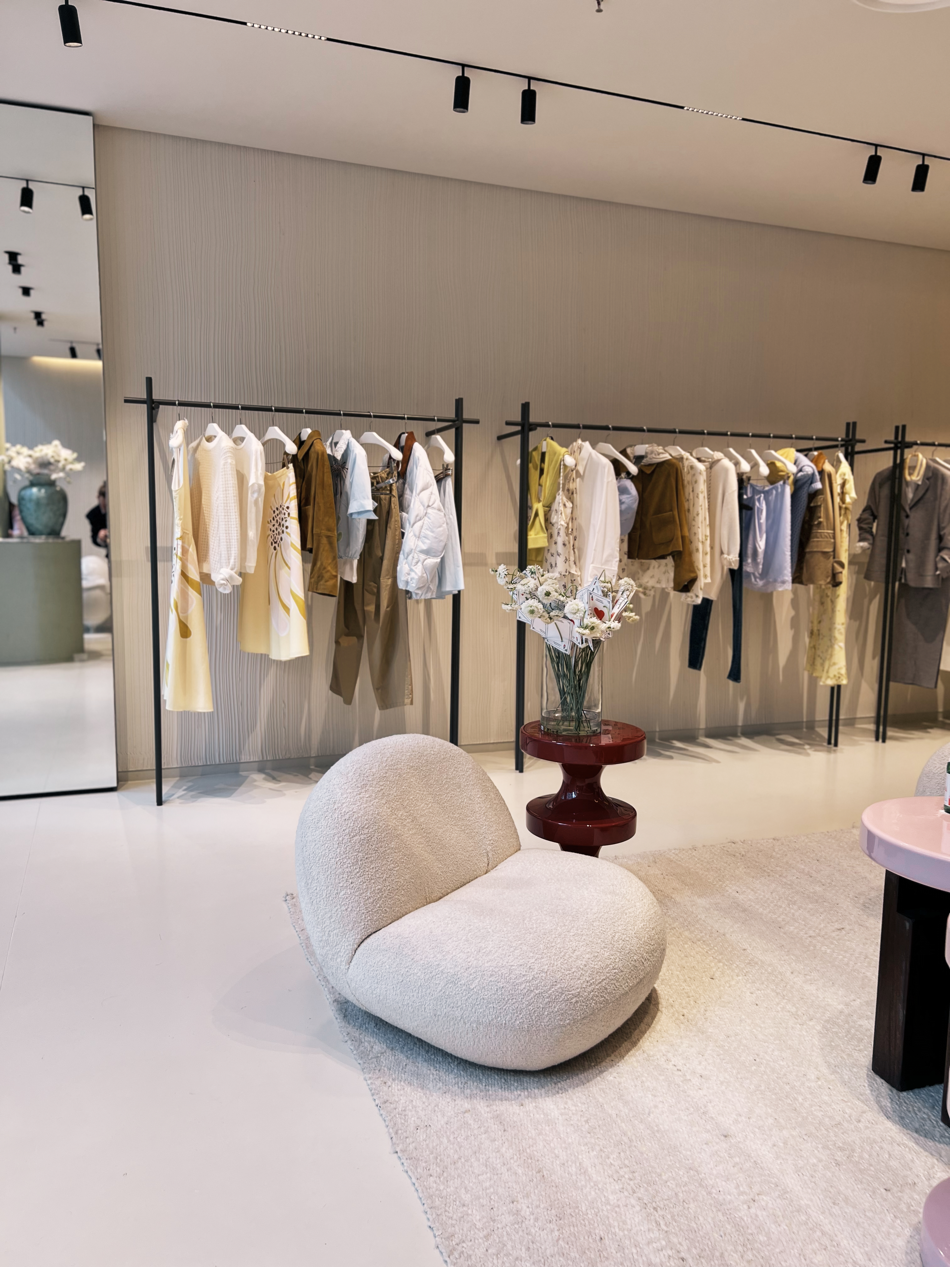 A stylish boucle chair in a Dorothee Schumacher store.