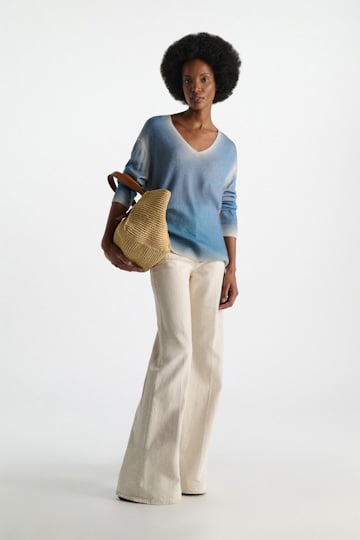 Dorothee Schumacher Pullover mit Poppy-Motiv auf dem Rücken aus Merino und Kaschmir poppy blue