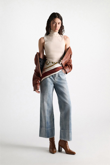 Dorothee Schumacher Sleeveless turtleneck in extra fine Merino camellia white Model Detail View
