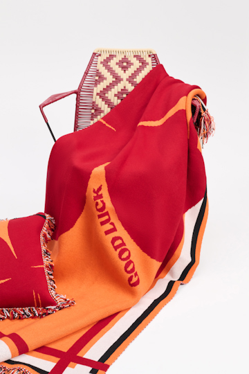 Dorothee Schumacher Wool blanket with GOOD LUCK clover motif orange verde militar mix